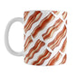 Bacon Pattern Mug (11oz) at Amy's Coffee Mugs. A ceramic coffee mug designed with a diagonal pattern of bacon strips that wraps around the mug to the handle. It's perfect for anyone who loves bacon and wants a breakfast-themed mug with their morning meal.