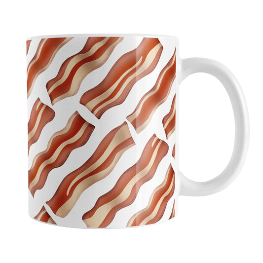 Bacon Pattern Mug (11oz) at Amy's Coffee Mugs. A ceramic coffee mug designed with a diagonal pattern of bacon strips that wraps around the mug to the handle. It's perfect for anyone who loves bacon and wants a breakfast-themed mug with their morning meal.