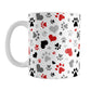 Black and Red Hearts and Paw Prints Mug (11oz) at Amy's Coffee Mugs. A ceramic coffee mug designed with a pattern of hearts and paw prints in red and different shades of black and gray that wraps around the mug to the handle. This mug is perfect for people love dogs and cute paw print designs.