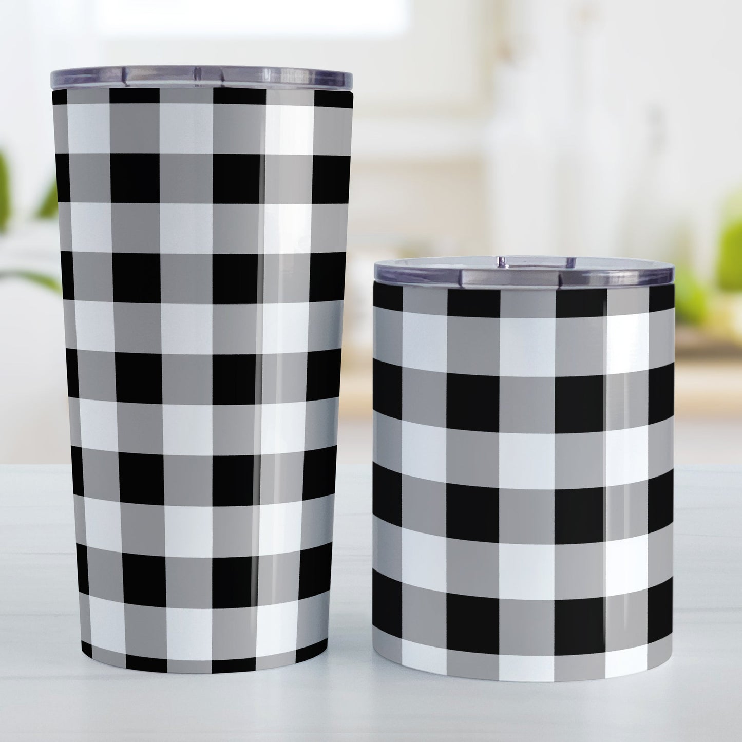 Black and White Buffalo Plaid Tumbler Cup (20oz and 10oz, stainless steel insulated) at Amy's Coffee Mugs. Tumbler cups designed with a black and white buffalo plaid (buffalo check) pattern that wraps around the cups. The photo shows both sized cups next to each other.