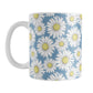 Blue Daisy Pattern Mug (11oz) at Amy's Coffee Mugs. A ceramic coffee mug designed with a pretty pattern of white daisy flowers with yellow centers over a speckled blue background that wraps around the mug to the handle. 