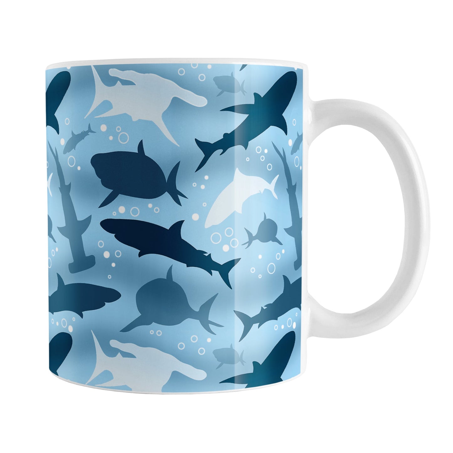 Blue Frenzy Sharks Mug (11oz) at Amy's Coffee Mugs. A ceramic coffee mug designed with a pattern of sharks in different shades of blue, in a frenzy deep beneath the water, that wraps around the mug to the handle.