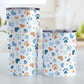 Blue Hearts and Paw Prints Tumbler Cup (20oz and 10oz) at Amy's Coffee Mugs. Stainless steel insulated tumbler cups designed with a pattern of hearts and paw prints in orange and different shades of blue that wraps around the cups. These tumbler cups are perfect for people love dogs and cute paw print designs. The photo shows both sized cups next to each other. 