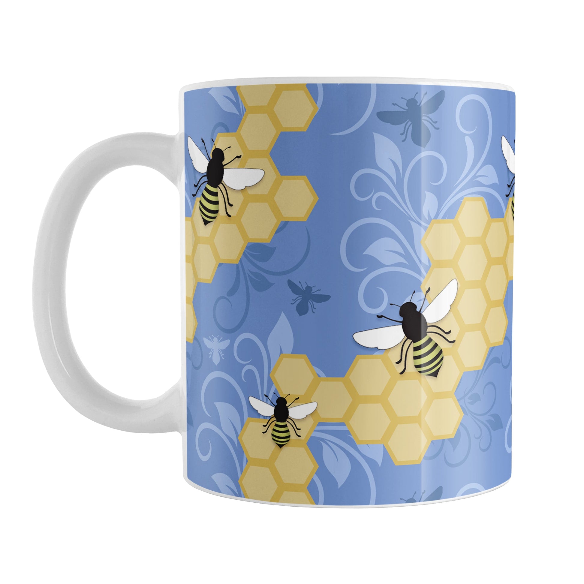 Blue Honeycomb Bee Mug (11oz) at Amy's Coffee Mugs. A ceramic coffee mug designed with a pattern of black and yellow bees on honeycomb lines over a blue flourish background that wraps around the mug to the handle.
