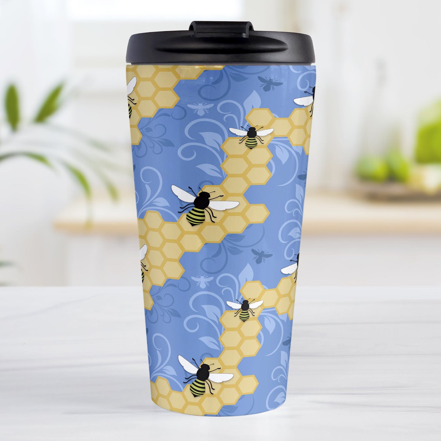 Blue Honeycomb Bee Travel Mug (15oz, stainless steel insulated) at Amy's Coffee Mugs. A travel mug designed with a pattern of black and yellow bees on honeycomb lines over a blue flourish background that wraps around the tapered shaped mug.