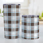 Brown Blue Plaid Tumbler Cup (20oz and 10oz) at Amy's Coffee Mugs. Stainless steel insulated tumbler cups designed with a brown plaid pattern with blue accents that wraps around the cups. Photo shows both sized cups next to each other.