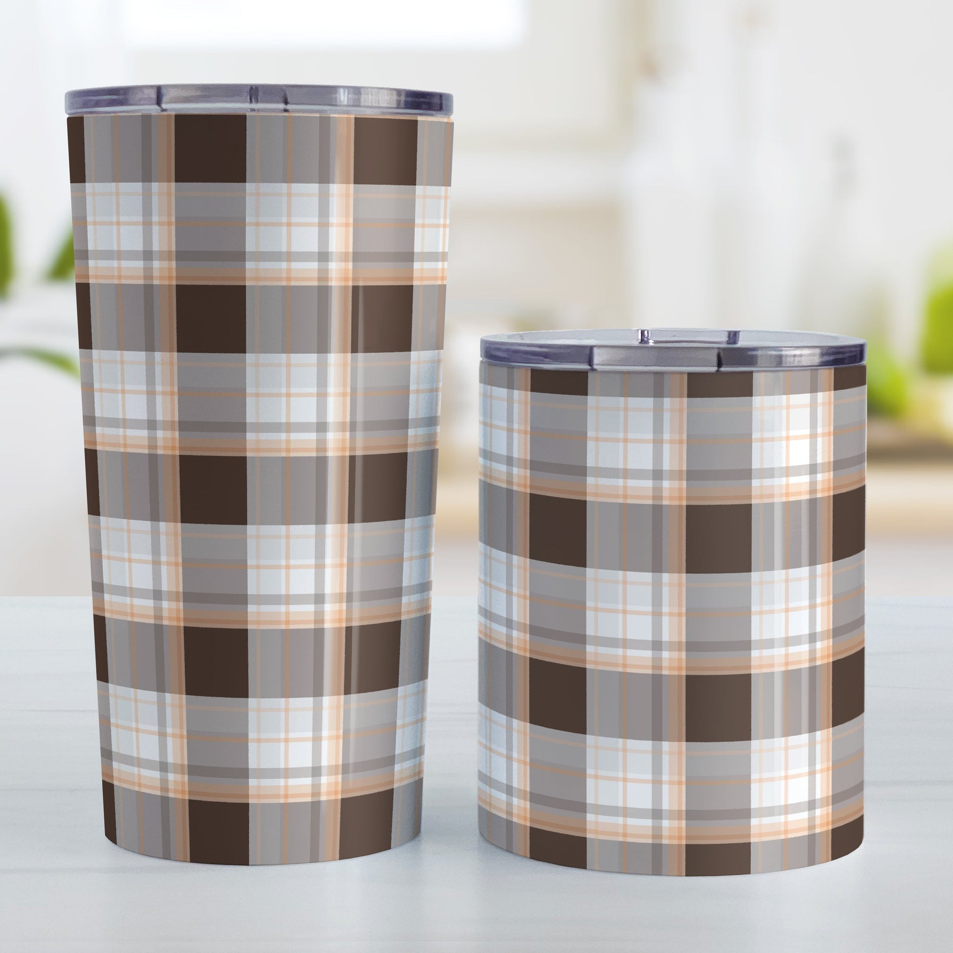 Brown Orange Plaid Tumbler Cup (20oz and 10oz) at Amy's Coffee Mugs. Stainless steel insulated tumbler cups designed with a brown plaid pattern with orange accents that wraps around the cups. Photo shows both sized cups next to each other.