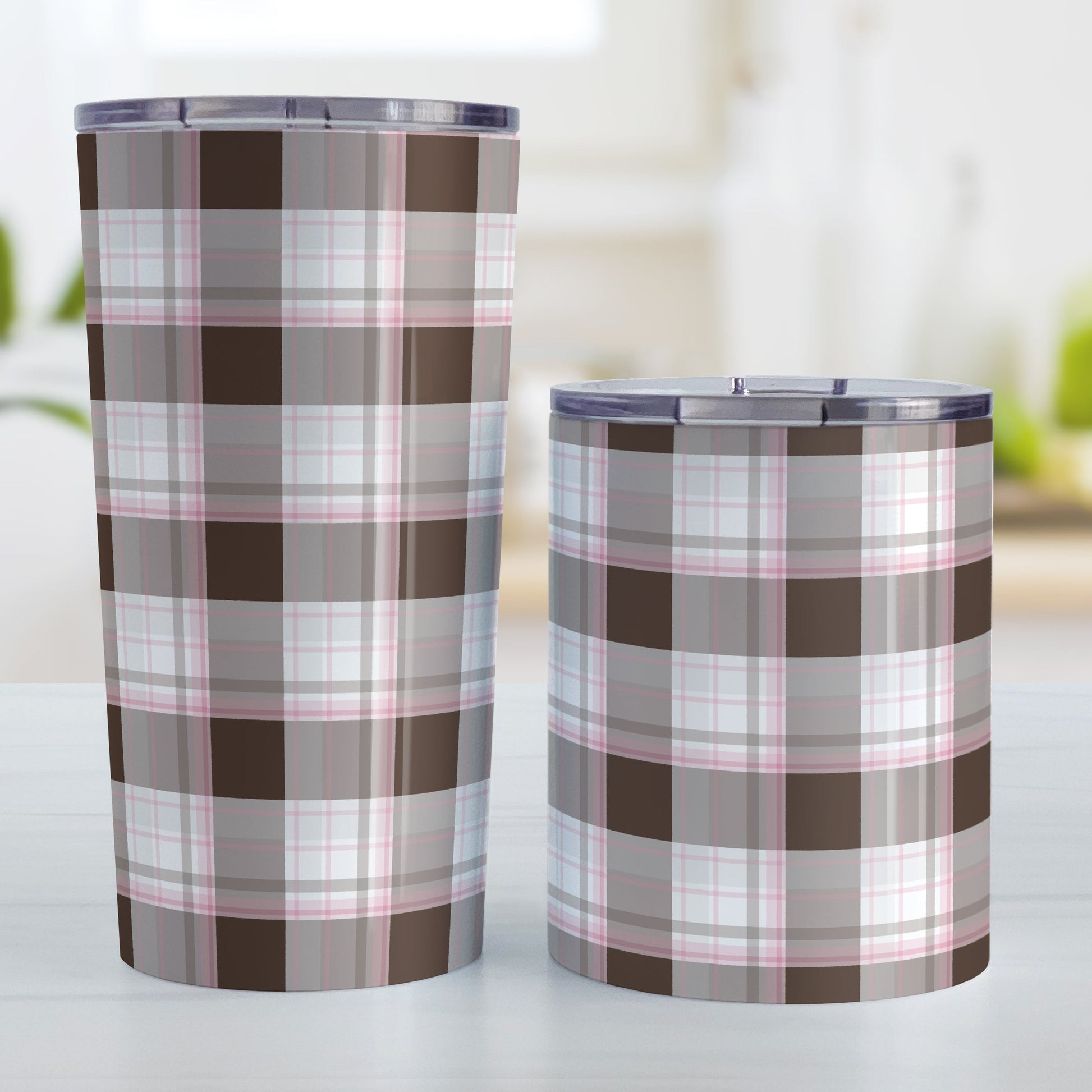 Brown Pink Plaid Tumbler Cup (20oz and 10oz) at Amy's Coffee Mugs. Stainless steel insulated tumbler cups designed with a brown plaid pattern with pink accents that wraps around the cups. Photo shows both sized cups next to each other.