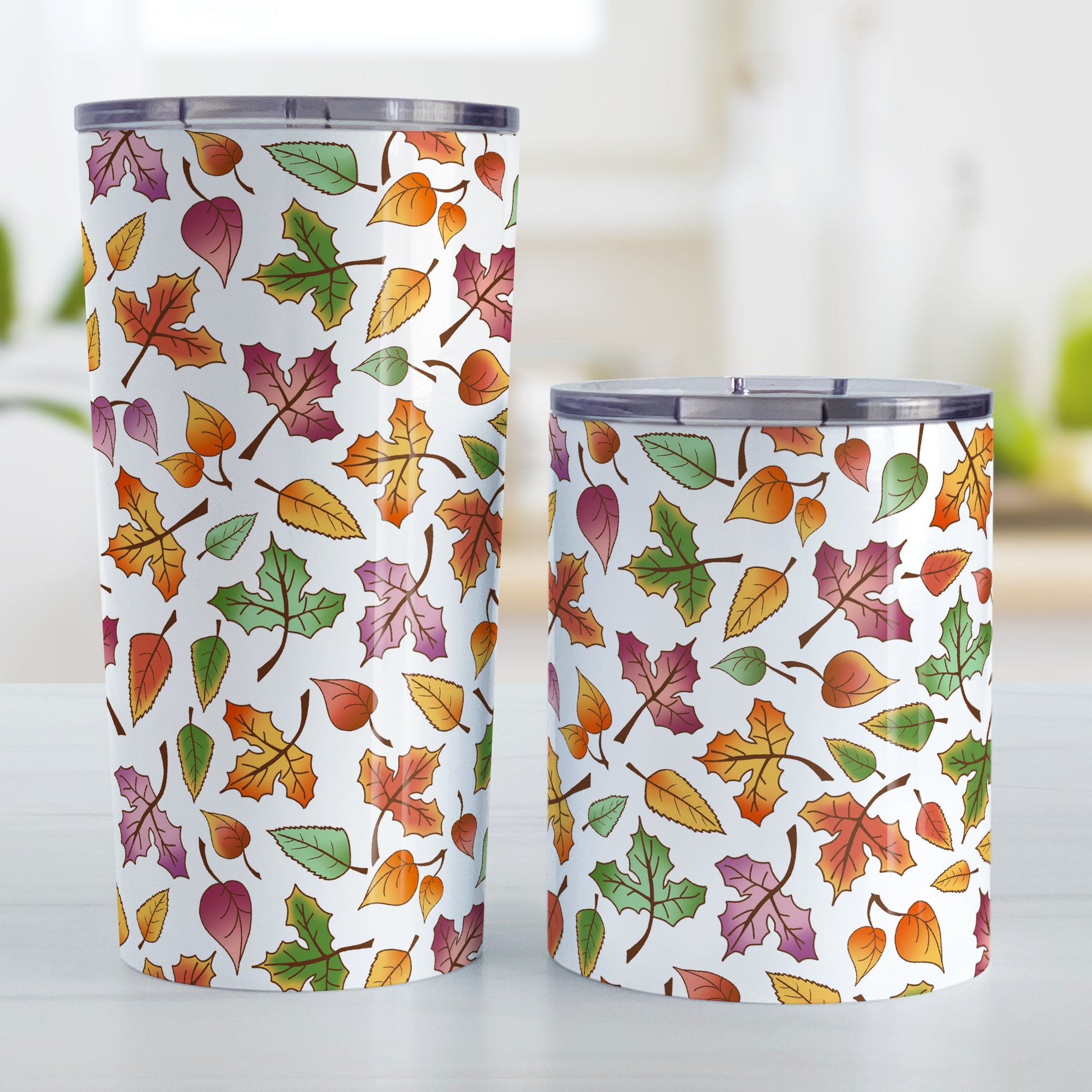 Changing Leaves Fall Tumbler Cup (20oz and 10oz) at Amy's Coffee Mugs. Stainless steel tumbler cups designed with a fall themed pattern of leaves changing colors, as they do at the beginning of autumn, that wraps around the cups.