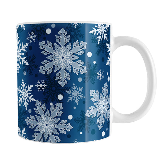 Classic Blue Snowflake Pattern Winter Mug (11oz) at Amy's Coffee Mugs. A ceramic coffee mug designed with a pattern of different shades of blue snowflakes over a classic blue background color that wraps around the mug.