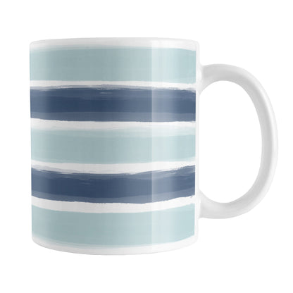 Coastal Blue Paint Strokes Mug (11oz) at Amy's Coffee Mugs. A ceramic coffee mug designed with a pattern of horizontal stripes done in a paint strokes illustration in coastal or nautical blue colors that wraps around the mug to the handle.