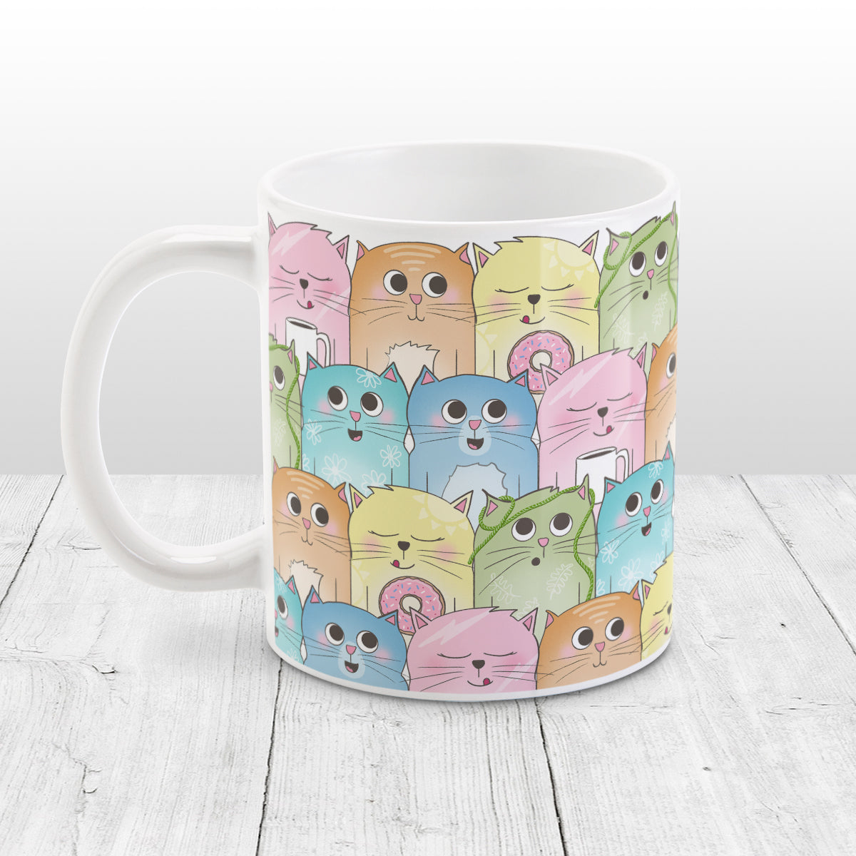 Colorful Cat Stack Pattern Mug (11oz) at Amy's Coffee Mugs. Cute cats mug with an illustrated pattern of different colorful cats (in pink, orange, yellow, green, turquoise, and blue) with different fun expressions, with yarn, coffee, and donuts. This stacked pattern of cats wraps around the ceramic mug to the handle.