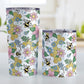 Colorful Pink Floral Bee Pattern Tumbler Cup (20oz and 10oz, stainless steel insulated) at Amy's Coffee Mugs. A tumbler cup designed with pink, blue, and green flowers and leaves with bees and golden yellow honeycomb pieces in a pattern that wraps around the cup. Photo shows both sized cups on a table next to each other.