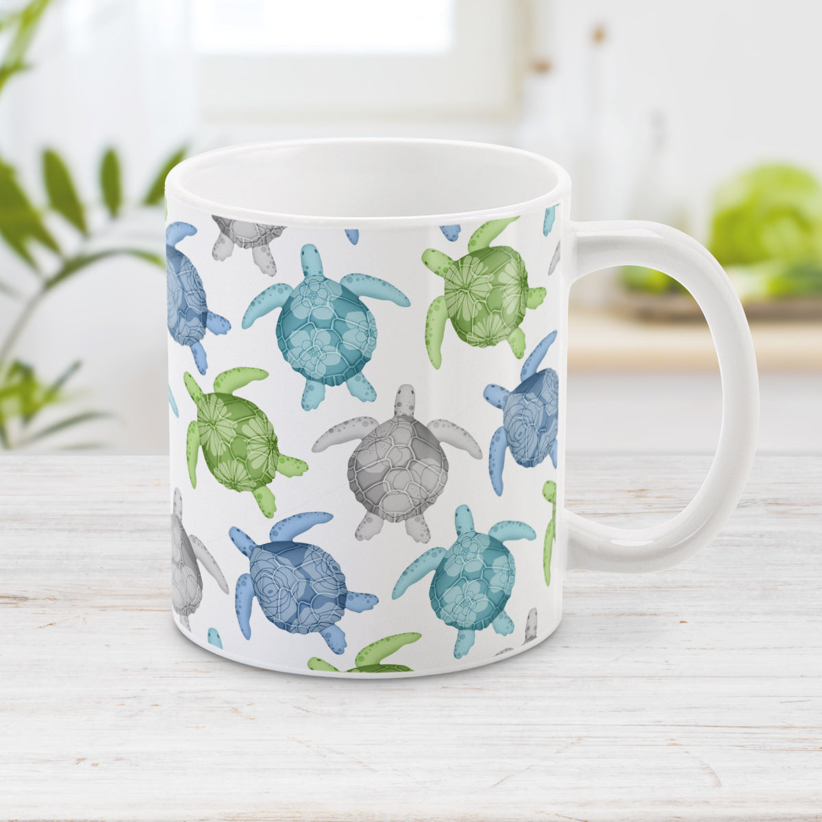 Cool Sea Turtles Pattern Mug (11oz) at Amy's Coffee Mugs. A ceramic mug with a pattern of sea turtles in a cool color palette of blue, green, turquoise and gray that wraps around the mug to the handle. Each cool colored sea turtle has a different floral watermark over its shell.