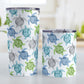 Cool Sea Turtles Pattern Tumbler Cup (20oz and 10oz, stainless steel insulated) at Amy's Coffee Mugs. A tumbler cup with a pattern of sea turtles in a cool color palette of blue, green, turquoise and gray that wraps around the cup. Each cool colored sea turtle has a different floral watermark over its shell. The photo shows both sizes of cups next to each other.