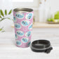 Cute Pink Narwhal Bubble Pattern Travel Mug (15oz) at Amy's Coffee Mugs. A travel mug designed with cute light blue narwhals in white circles and with bubbles scattered over a pink background color in a pattern that wraps around the travel mug. Photo shows the mug open on a table with the lid next to it. 