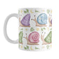 Cute Spring Summer Snails Pattern Mug (11oz) at Amy's Coffee Mugs. A cute snail mug with a whimsical pattern of snails with happy faces in two rows around the mug with pink, purple, blue, and green shells floral and stars watermarks, with foliage, moons, and stars between the rows.