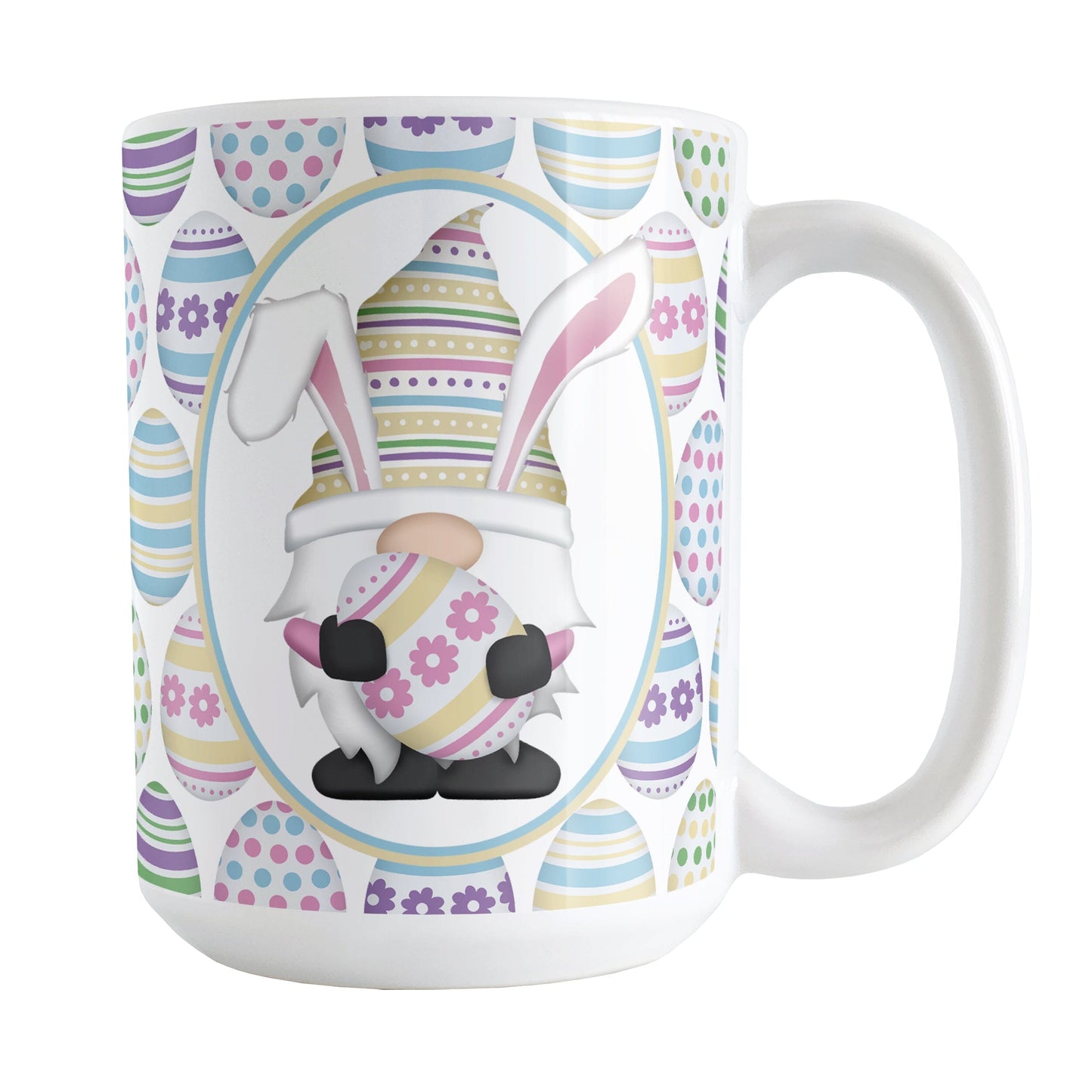 Easter Gnome Eggs Mug (15oz) at Amy's Coffee Mugs. A ceramic coffee mug designed with an illustration of an adorable gnome with bunny ears, holding a large pink and yellow Easter egg, in a white oval on both sides of the mug over a decorated Easter eggs pattern.