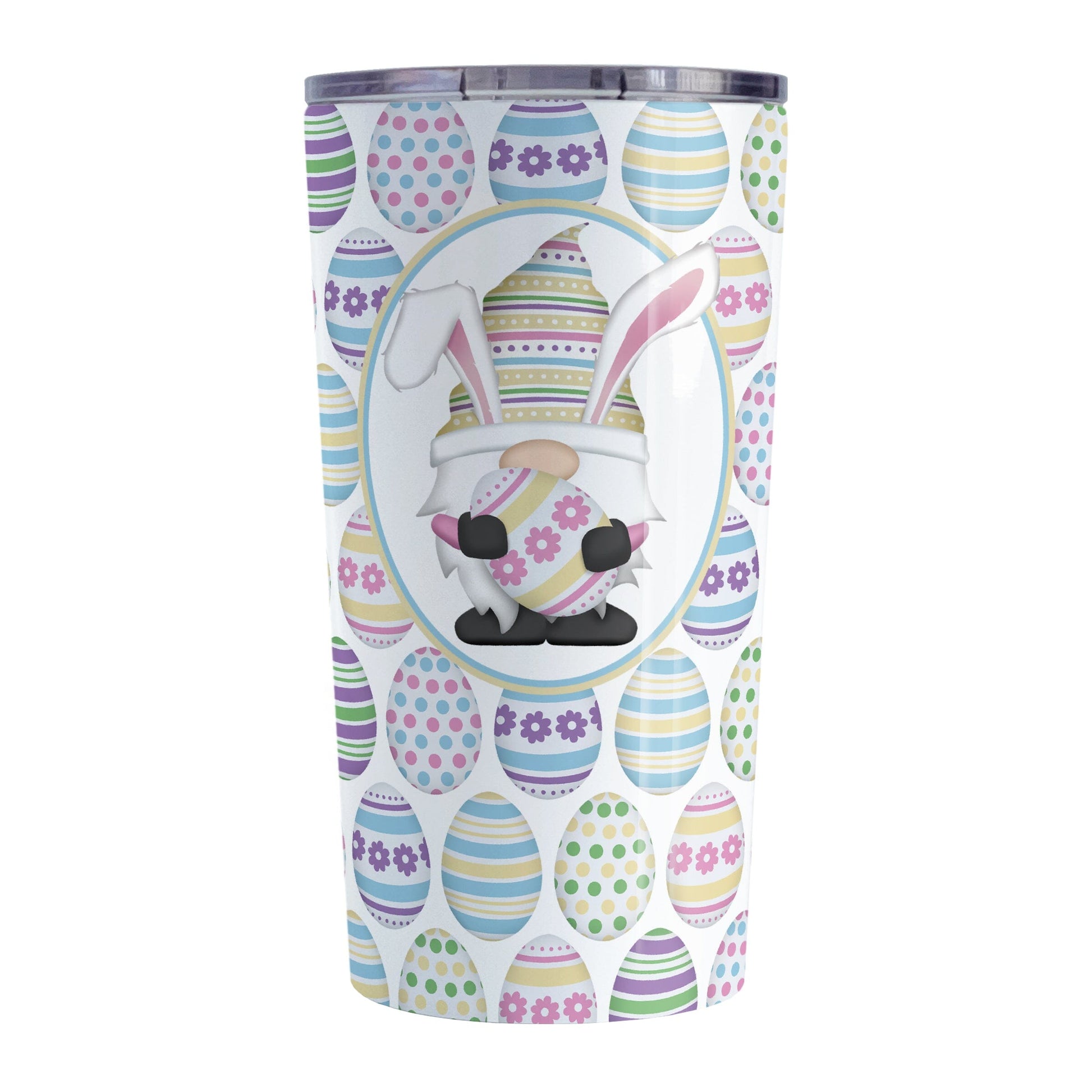 Easter Gnome Eggs Tumbler Cup (20oz) at Amy's Coffee Mugs. A stainless steel tumbler cup designed with an illustration of an adorable gnome with bunny ears, holding a large pink and yellow Easter egg, in a white oval over a decorated Easter eggs pattern that wraps around the cup.