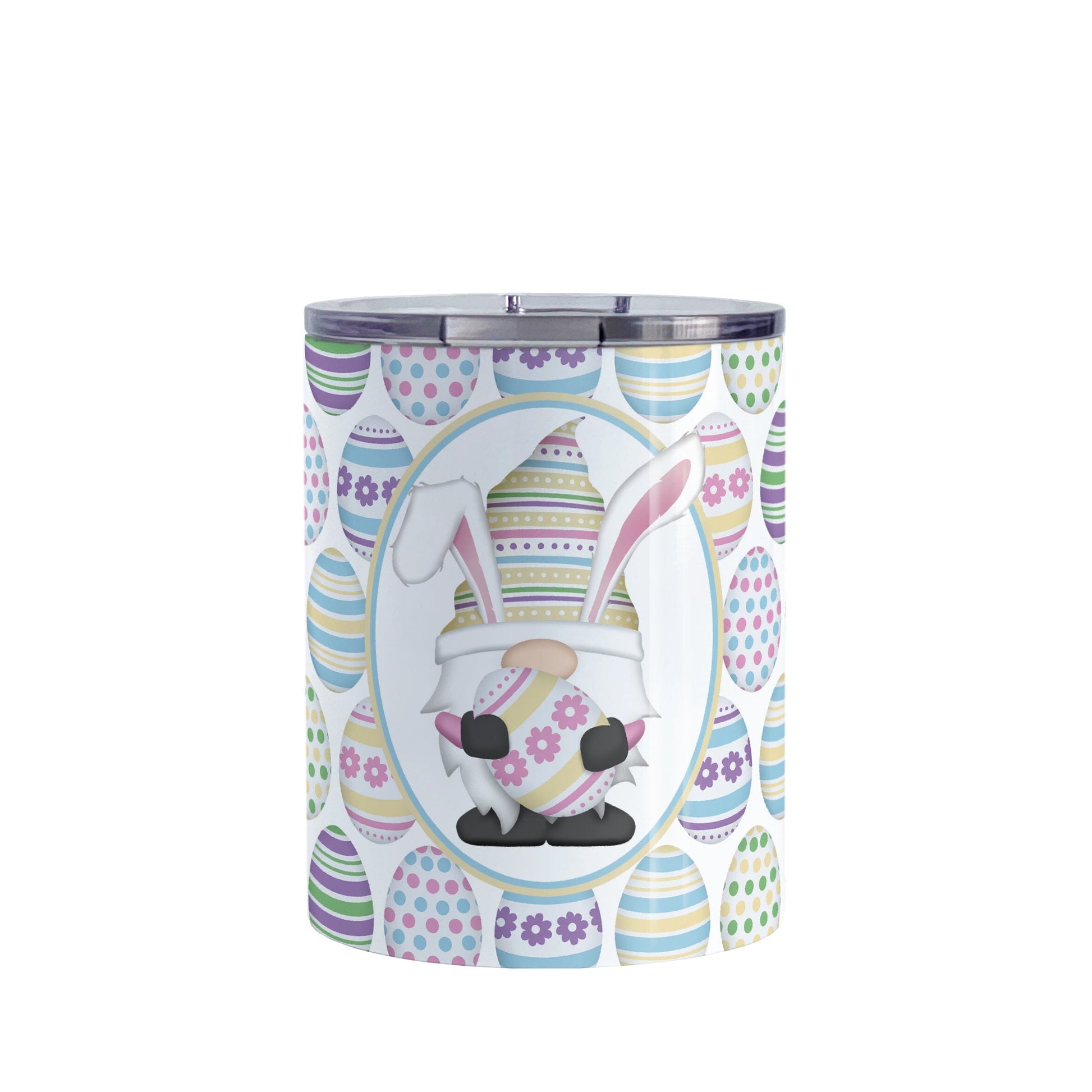 Easter Gnome Eggs Tumbler Cup (10oz) at Amy's Coffee Mugs. A stainless steel tumbler cup designed with an illustration of an adorable gnome with bunny ears, holding a large pink and yellow Easter egg, in a white oval over a decorated Easter eggs pattern that wraps around the cup.