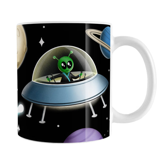Galaxy Green Alien Spaceship Mug (11oz) at Amy's Coffee Mugs. A galaxy spaceship mug designed with an illustration of a green alien in a spaceship in a galaxy design with planets, stars, comets, and a moon over a black background.