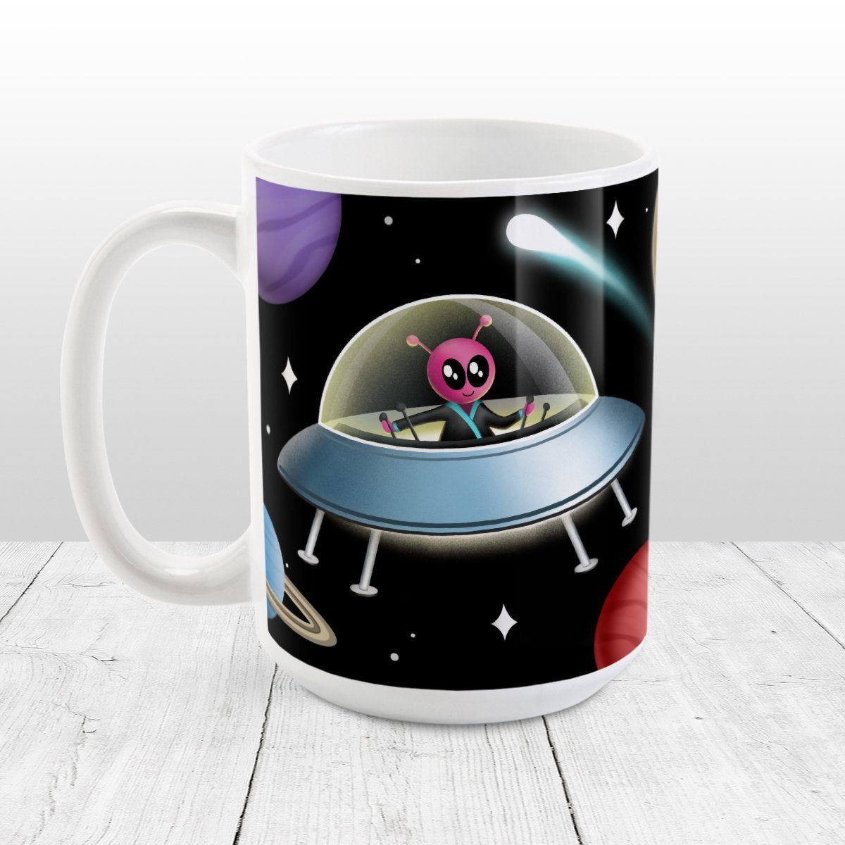 Galaxy Pink Alien Spaceship Mug at Amy's Coffee Mugs. A galaxy spaceship mug designed with an illustration of a pink alien in a spaceship in a galaxy design with planets, stars, comets, and a moon over a black background.
