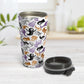 Ghosts and Spirits Halloween Travel Mug (15oz) at Amy's Coffee Mugs. A stainless steel insulated travel mug designed with a whimsical pattern of purple, orange, black and gray ghosts and spirits that wraps around the travel mug. Photo shows the mug open with the lid on the table beside it.