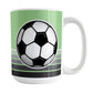 Gray Gradient Lined Green Soccer Ball Mug (15oz) at Amy's Coffee Mugs. A ceramic coffee mug designed with a big soccer ball on both sides of the mug over gradient black to gray lines along the bottom over a green background color that wraps around the mug up to the handle.