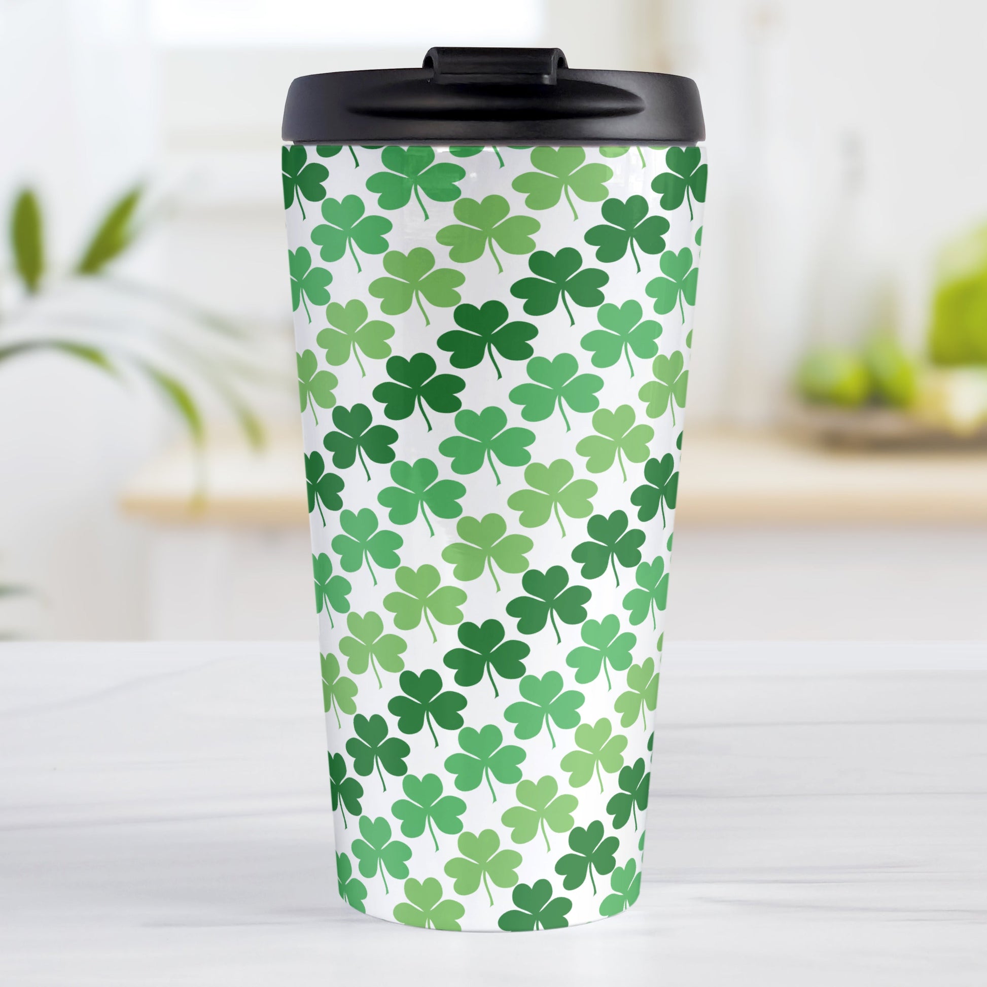 Green Clovers Travel Mug (15oz, stainless steel insulated) at Amy's Coffee Mugs. A travel mug designed with a pattern of clovers (shamrocks) in three different shades of green that wraps around the travel mug.