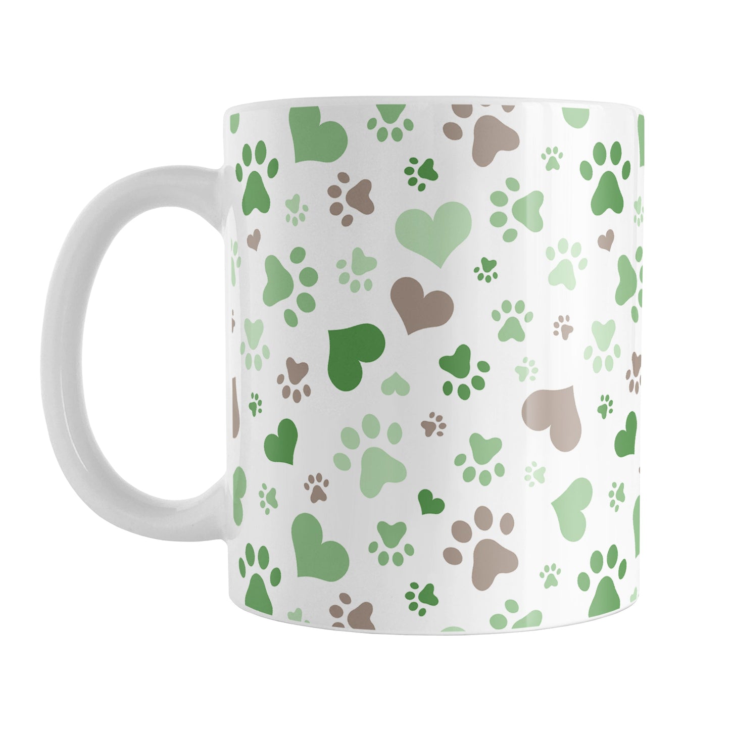 Green Hearts and Paw Prints Mug (11oz) at Amy's Coffee Mugs. A ceramic coffee mug designed with a pattern of hearts and paw prints in brown and different shades of green that wraps around the mug to the handle. This mug is perfect for people love dogs and cute paw print designs.