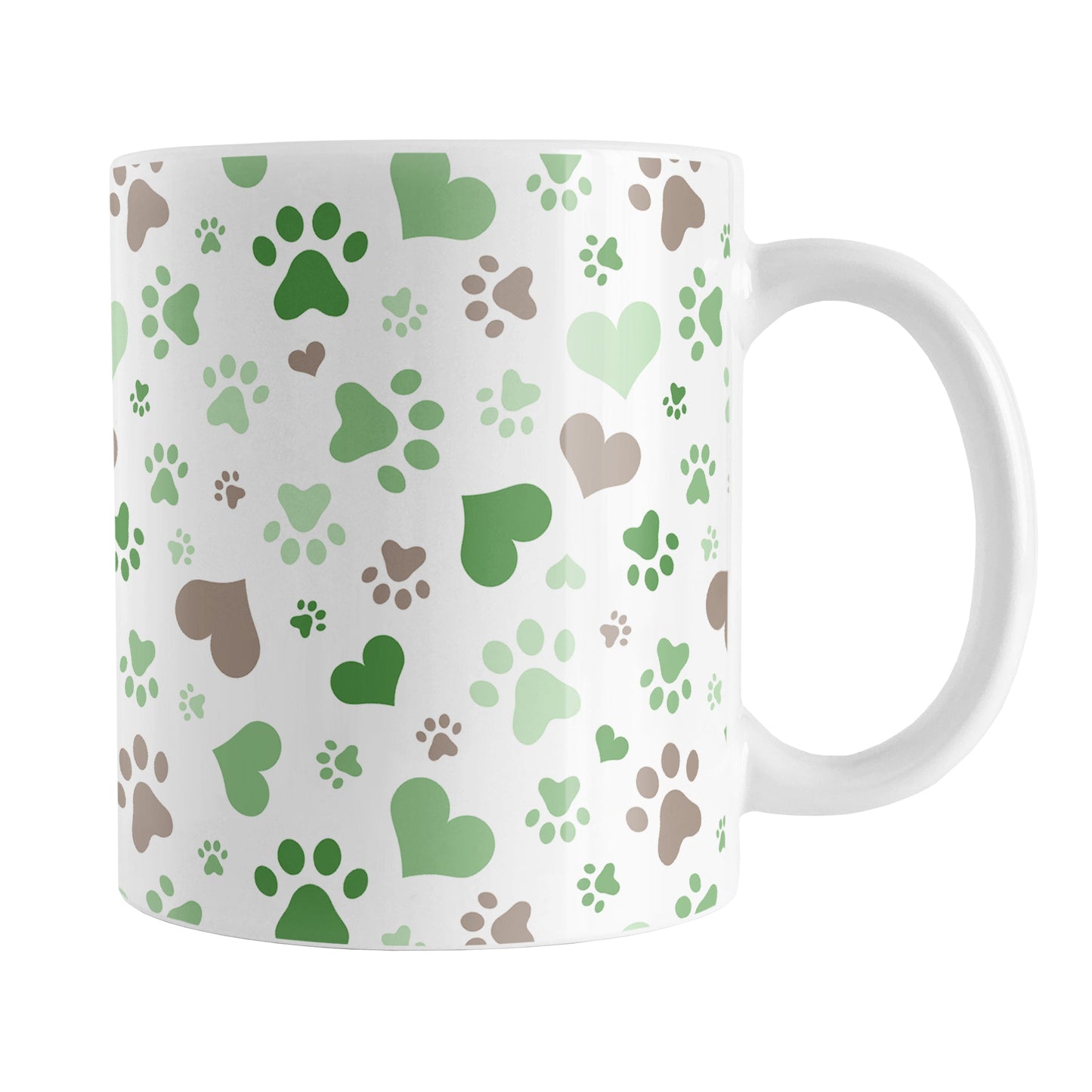 Green Hearts and Paw Prints Mug (11oz) at Amy's Coffee Mugs. A ceramic coffee mug designed with a pattern of hearts and paw prints in brown and different shades of green that wraps around the mug to the handle. This mug is perfect for people love dogs and cute paw print designs.