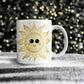 Happy Sun Mug (11oz) with a black and gold sparkly background behind the mug.