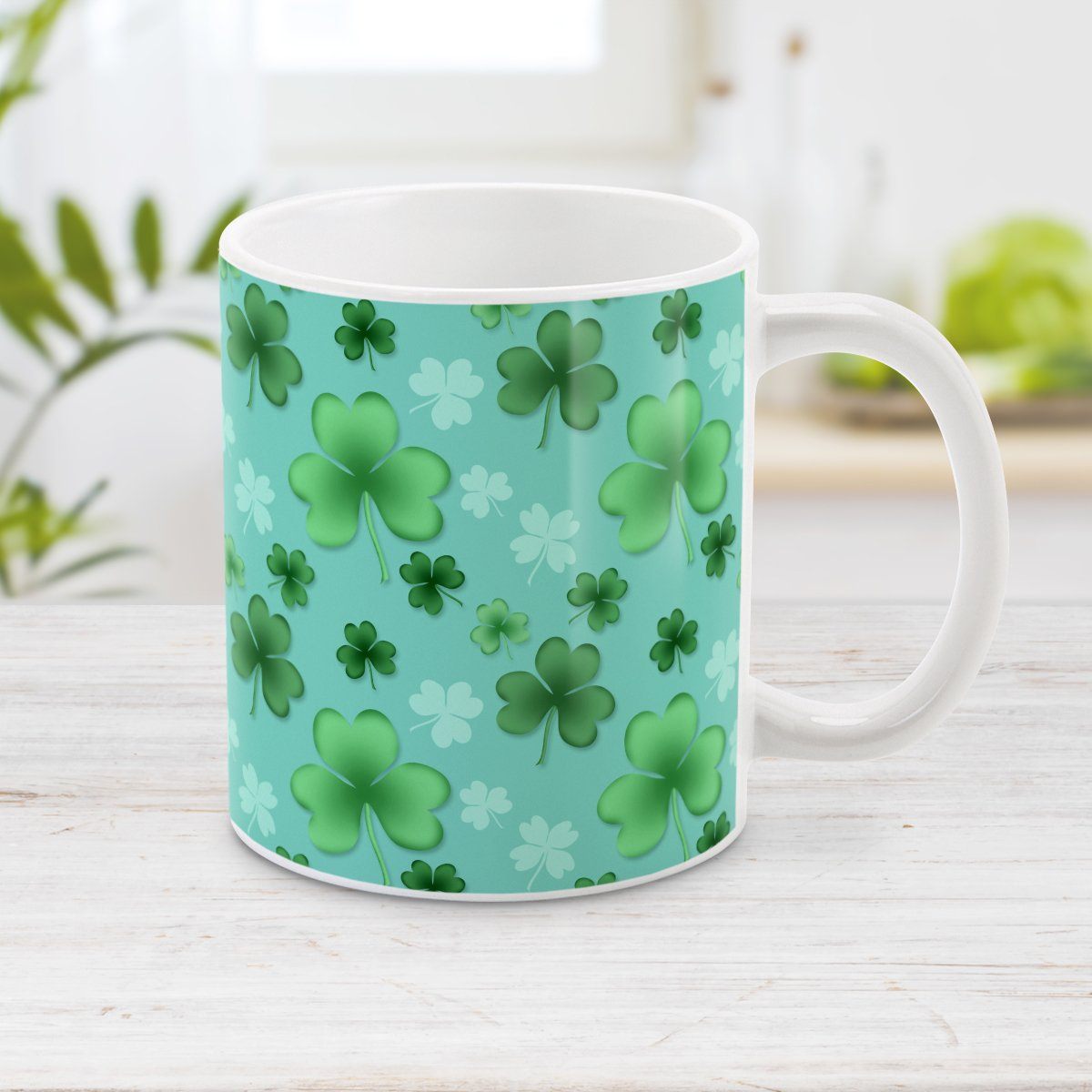 Clover Mug - St Patrick's Day - Lucky Clover Pattern Teal and Green - Clover Mug at Amy's Coffee Mugs. A ceramic coffee mug designed with a lucky green clover pattern with a 4-leaf clover among 3-leaf clovers, in different shades of green, over a teal background that wraps around the mug to the handle.