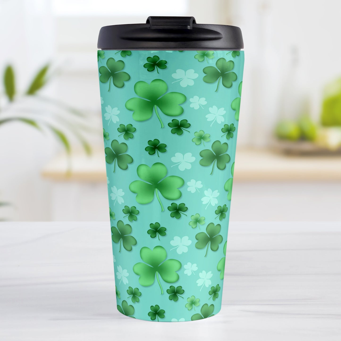Lucky Clover Pattern Teal and Green Travel Mug (15oz, stainless steel insulated) at Amy's Coffee Mugs. A travel mug designed with a lucky green clover pattern with a 4-leaf clover among 3-leaf clovers, in different shades of green, over a teal background that wraps around the mug.
