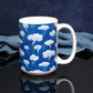My Thunderstorm Mug (15oz) on a glossy black tabletop and a midnight blue background.