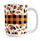 Orange Buffalo Plaid Leaves Fall Mug (15oz) at Amy's Coffee Mugs. A ceramic coffee mug designed with a pattern of leaves with an orange and black buffalo plaid pattern and a buffalo plaid stripe across the center over the leaves. This design wraps around the mug to the handle.