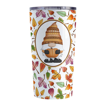 Orange Gnome Fall Leaves Tumbler Cup (20oz) at Amy's Coffee Mugs. A stainless steel tumbler cup designed with an adorable orange hat gnome holding an orange pumpkin in a white oval over a pattern of leaves in different fall colors that wrap around the cup. 