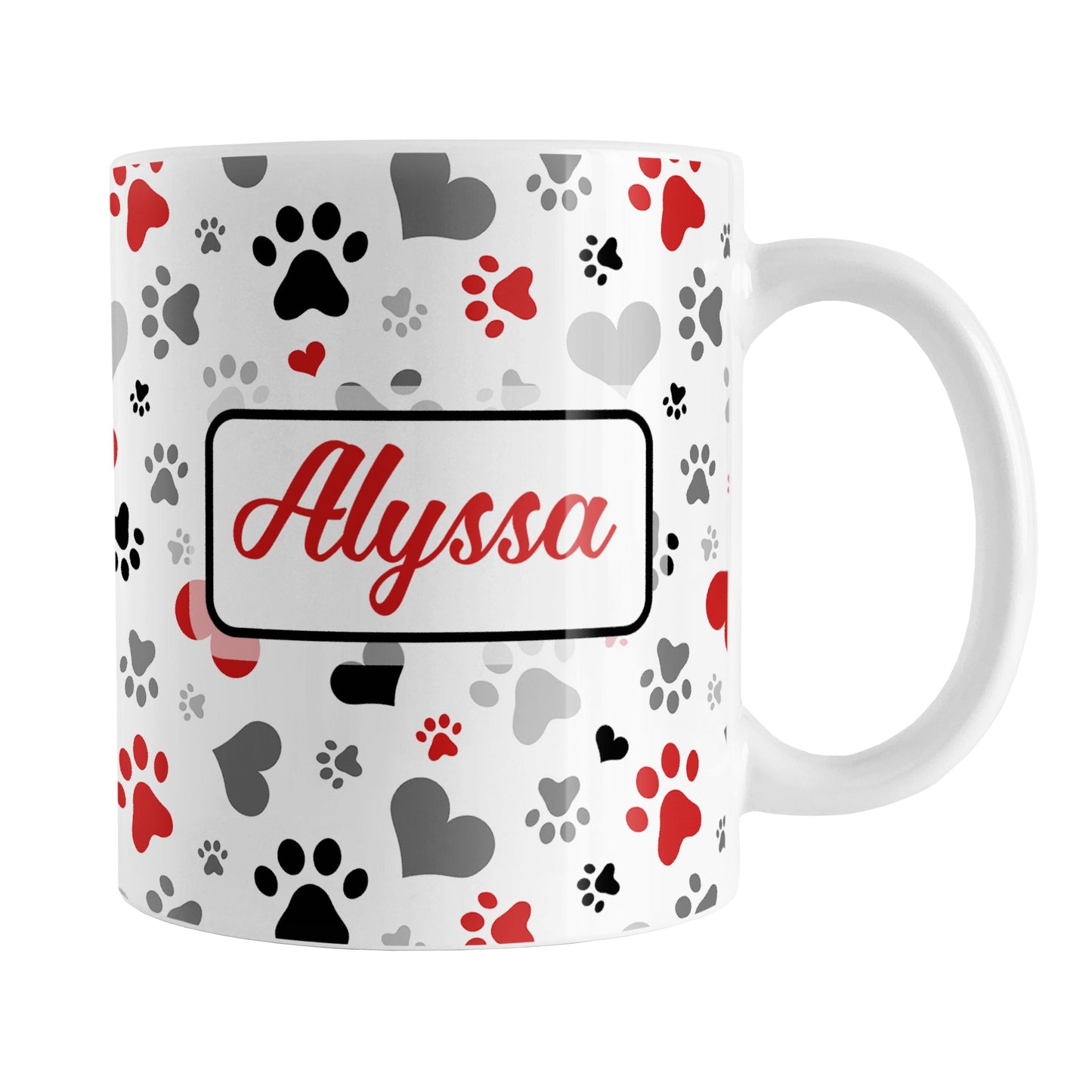 Personalized Black and Red Hearts and Paw Prints Mug (11oz) at Amy's Coffee Mugs. A ceramic coffee mug designed with a pattern of hearts and paw prints in red, black, and gray that wraps around the mug to the handle. Your name is custom printed in a red script font in a white rectangle on both sides of the mug over the paw prints pattern.
