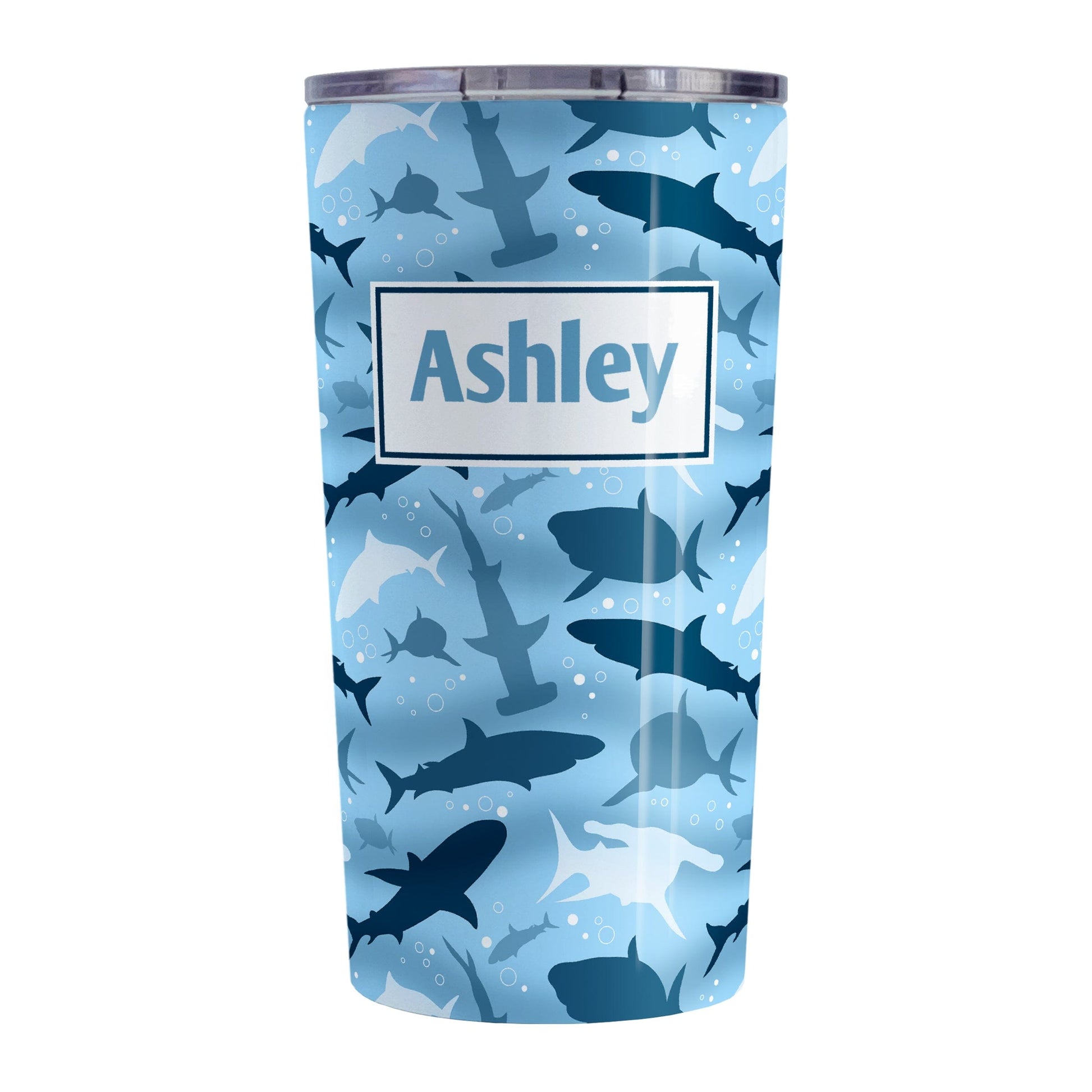 Personalized Blue Frenzy Sharks Tumbler Cup (20oz) at Amy's Coffee Mugs. A stainless steel insulated tumbler cup designed with a pattern of sharks in different shades of blue, in a frenzy deep beneath the water, that wraps around the cup. Your personalized name is custom printed in blue over the shark pattern.