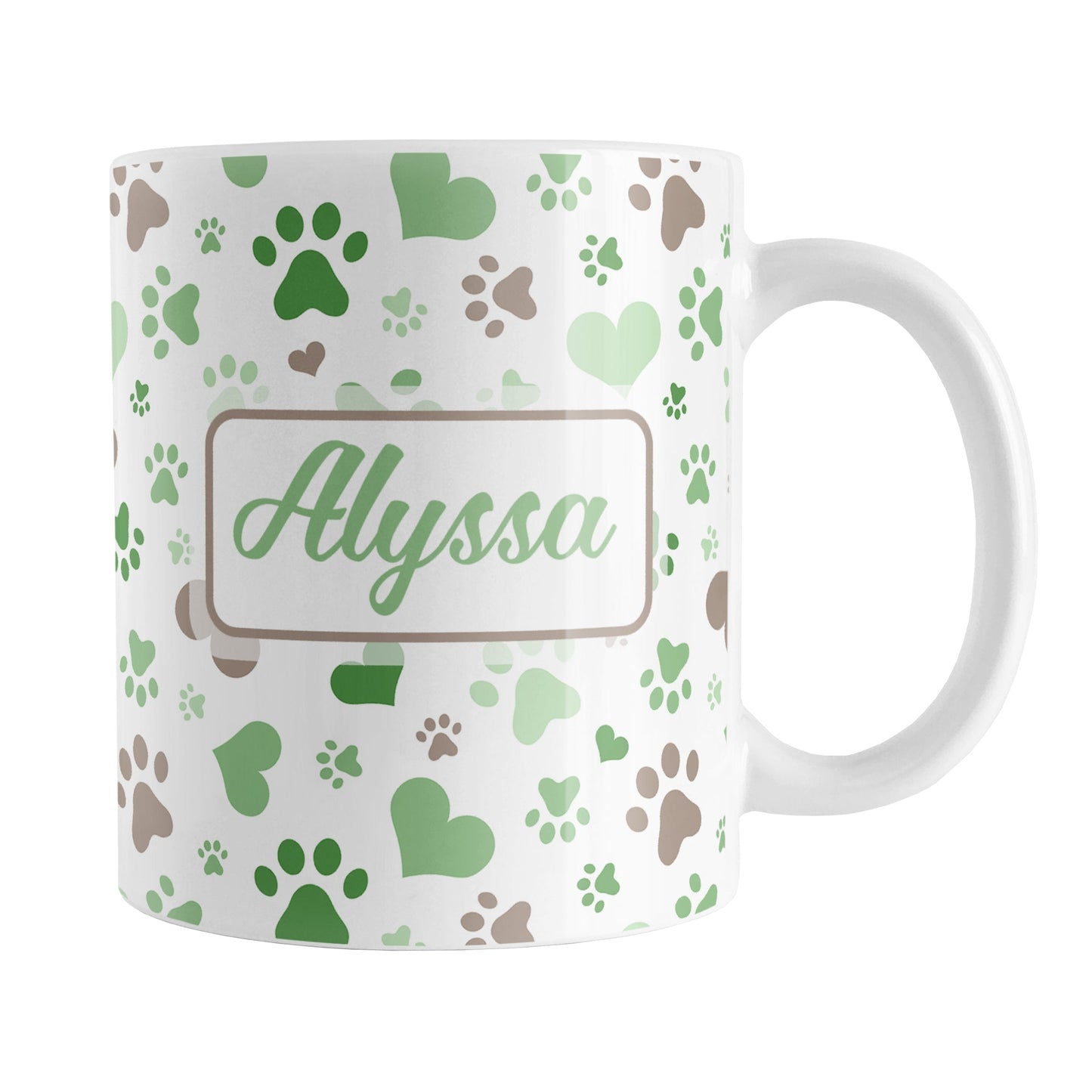 Personalized Green Hearts and Paw Prints Mug (11oz) at Amy's Coffee Mugs. A ceramic coffee mug designed with a pattern of hearts and paw prints in green and brown that wraps around the mug to the handle. Your name is personalized in green on both sides of the mug.