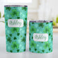 Personalized Lucky Clover Pattern Teal and Green Tumbler Cup (20oz and 10oz, stainless steel insulated) at Amy's Coffee Mugs. Tumbler cups designed with a lucky green clover pattern with a 4-leaf clover among 3-leaf clovers, in different shades of green, over a teal background that wraps around the cups. Your name is personalized in green on white, over the lucky clover pattern. Photo shows both sized cups next to each other.