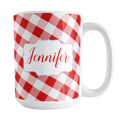 Personalized Red Gingham Mug (15oz) at Amy's Coffee Mugs. A ceramic coffee mug designed with a slanted red and white gingham pattern that wraps around the mug up to the handle. Your personalized name is custom-printed in a red script font on both sides of the mug over the gingham pattern.