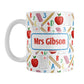 Personalized School Pattern Mug (11oz) at Amy's Coffee Mugs. A ceramic coffee mug designed with a school-themed pattern with apples, rulers, erasers, graded papers, numbers, and letters that wraps around the mug to the handle. Your personalized name or your teacher's name is custom printed on both sides of the mug over the school pattern.