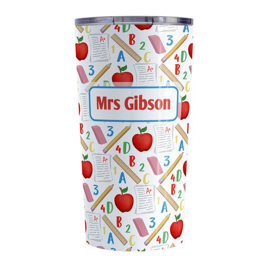 Personalized School Pattern Tumbler Cup (20oz) at Amy's Coffee Mugs. A stainless steel tumbler cup designed with a school-themed pattern with apples, rulers, erasers, graded papers, numbers, and letters that wraps around the cup. Your personalized name or your teacher's name is custom printed in red over the school pattern.