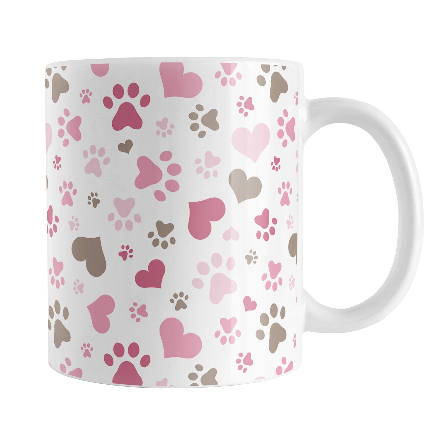 Pink Hearts and Paw Prints Mug (11oz) at Amy's Coffee Mugs. A ceramic coffee mug designed with a pattern of hearts and paw prints in brown and different shades of pink that wraps around the mug to the handle. This mug is perfect for people love dogs and cute paw print designs.