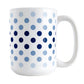 Polka Dots in Blue Mug (15oz) at Amy's Coffee Mugs. A ceramic coffee mug designed with polka dots in different shades of blue, with the darker blue color across the middle and the lighter blue along the top and bottom, in a pattern that wraps around the mug to the handle. 
