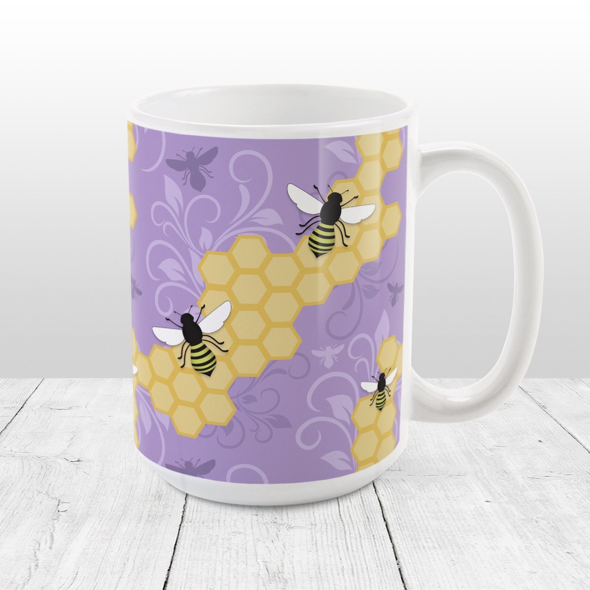 Purple Honeycomb Bee Mug at Amy's Coffee Mugs. A ceramic coffee mug designed with a pattern of black and yellow bees on honeycomb lines over a purple flourish background that wraps around the mug to the handle.