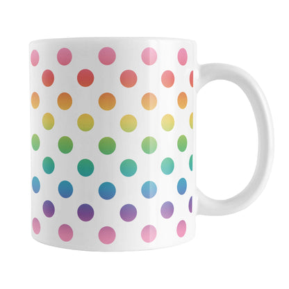 Rainbow Polka Dots Mug (11oz) at Amy's Coffee Mugs. A ceramic coffee mug designed with a pattern of polka dots in a vertical rainbow gradient progression over white that wraps around the mug.