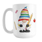School Teacher Gnome Mug (15oz) at Amy's Coffee Mugs. A ceramic coffee mug designed with an illustration of an adorable gnome wearing a festive hat with numbers and letters in primary colors and holding a large oversized pencil and graded A+ paper. Around the gnome is an eraser, a ruler, and a red apple.