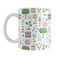 Spring Gardening Pattern Mug (11oz) at Amy's Coffee Mugs. A ceramic coffee mug designed with a springtime gardening pattern with trees, plants, flowers, seed packets, watering cans, fences, and gardening tools in spring colors such as pink, blue, green, and brown. 